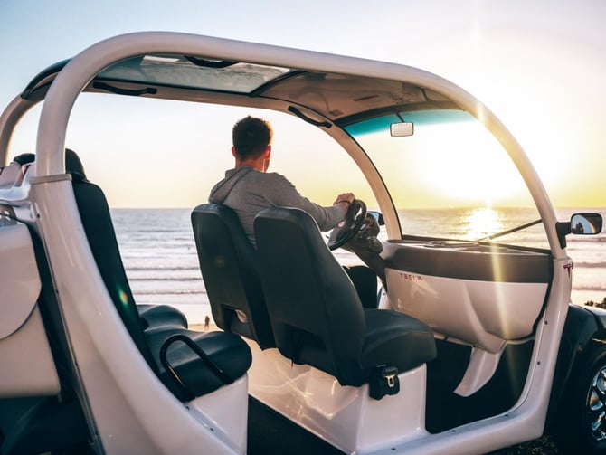 Man driving golf cart