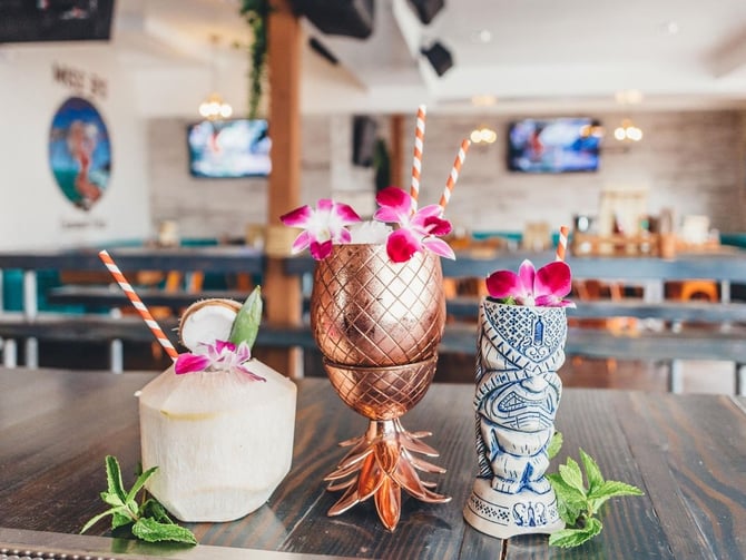 Miss B's Coconut Club tropical-themed bar and grill with outdoor seating in Mission Beach